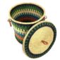 The closed laundry basket with its lid off, showing green, teal and orange stripes, a woven lid and leather ring handles