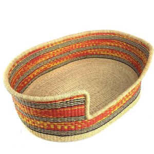 Angled view of the XXL red and orange pet basket showing the woven elephant grass base