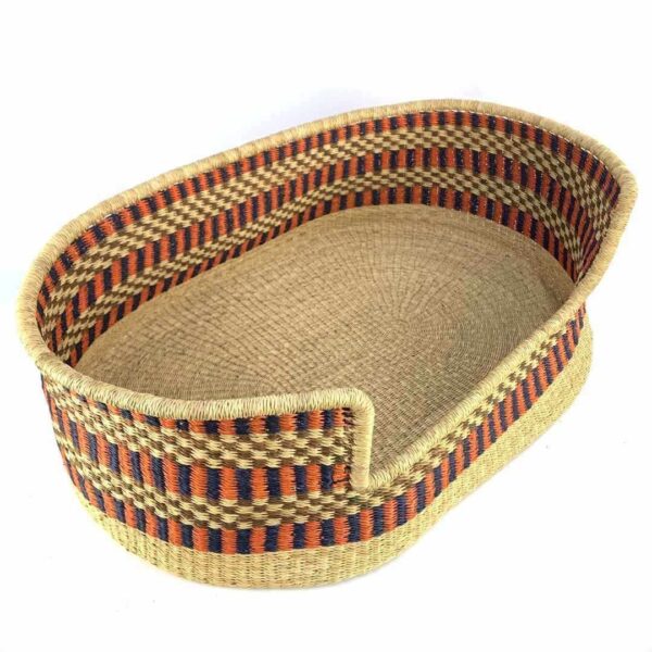 extra-extra-large-pet-dog-basket-010-soukous-2 Angled view of the XXL orange and navy pet basket showing the woven elephant grass base