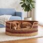 XXL orange and navy checked Bolga pet basket with a sleeping dog inside, in a living room