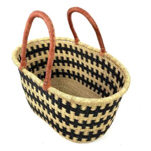 Angled view of the extra large oval Bolga basket with an all-over black and natural check, showing the woven interior