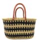 Front view of the extra large oval Bolga basket with an all-over black and natural check on a white background
