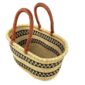 Angled view of the extra large oval Bolga basket with two black stepped bands on natural straw, showing the woven interior