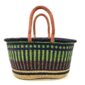 Front view of the extra large oval Bolga basket with lime green vertical stripes over navy, with a navy rim on a white background