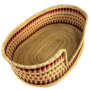 Angled view of the extra large Bolga dog bed showing rows of red, black, and brown flecks