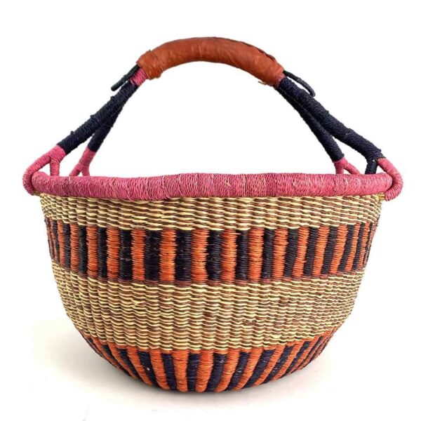 extra-large-round-basket-558-sprinkles-3 Front view of the orange and pink XL round Bolga basket with a leather-wrapped handle on a white background