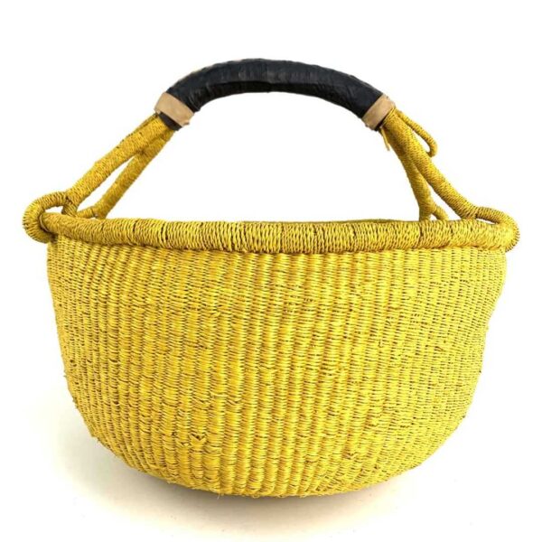 extra-large-round-basket-561-lightbeam-3 Front view of the yellow XL round Bolga basket with a leather-wrapped handle on a white background