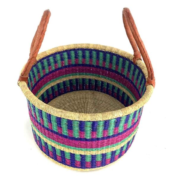 hamper-basket-186-wishywashy-jewel-tone-stripes-bolga-bashiri-2 Angled view of the jewel-toned hamper basket showing the coiled elephant grass interior