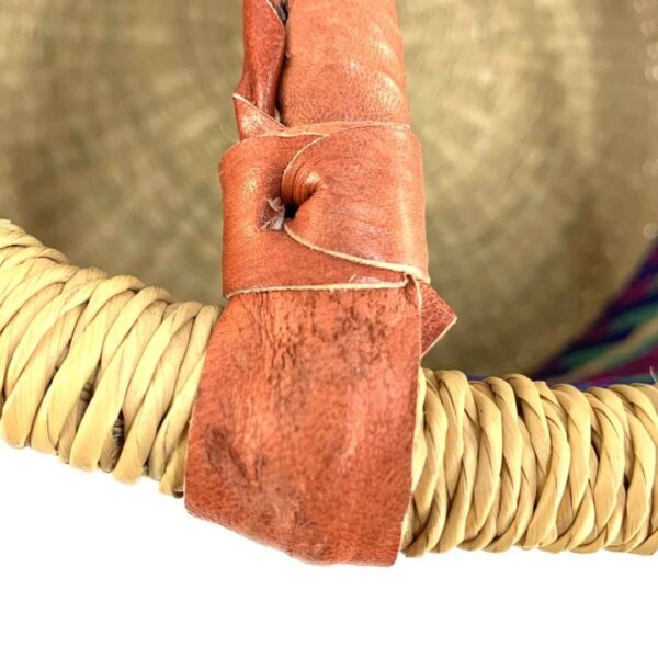 hamper-basket-186-wishywashy-jewel-tone-stripes-bolga-bashiri-6 Close-up of the scuffed leather handle join on the jewel-toned hamper basket