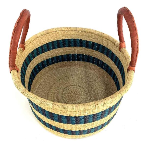 hamper-basket-set-028-pickleball-natural-dark-stripes-woven-bashiri-2 Angled view of the natural hamper basket with dark stripes showing the woven interior