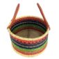 Angled view of the warm striped hamper basket showing the woven interior