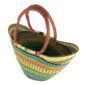 Angled view of the lime green, teal and orange extra large market basket with rounded handles