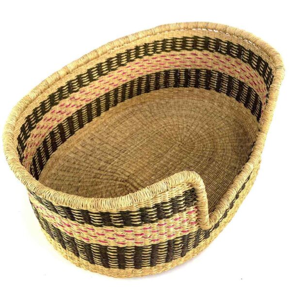 medium-pet-basket-025-bobby-dog-bed-charcoal-pink-elephant-grass-bolga-bashiri-2 Angled view of the medium Bolga dog bed showing the charcoal and pink bands inside