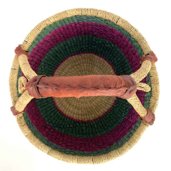 medium-round-basket-665-coastal-woven-3 Front view of the medium round Bolga basket with green, navy and pink zigzag pattern