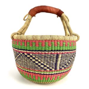 medium-round-basket-666-paradise-woven-2 Angled view of the medium round Bolga basket showing coral pink, green and navy zigzag pattern