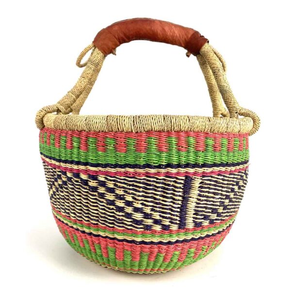 medium-round-basket-666-paradise-woven-2 Angled view of the medium round Bolga basket showing coral pink, green and navy zigzag pattern
