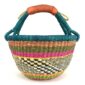 Angled view of the medium round Bolga basket showing a teal-wrapped rim and handle over terracotta, olive and magenta bands with a black-and-cream diamond weave