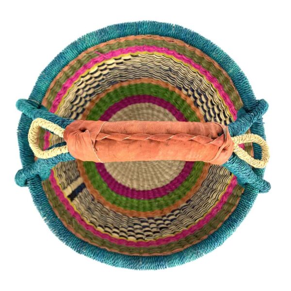 medium-round-basket-667-habitat-woven-3 Front view of the medium round Bolga basket with a teal-wrapped rim and handle over terracotta, olive and magenta bands with a black-and-cream diamond weave