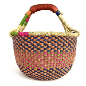 medium-round-basket-668-tangible-woven-2 Angled view of the medium round Bolga basket showing a navy, orange, magenta and green checkerboard weave
