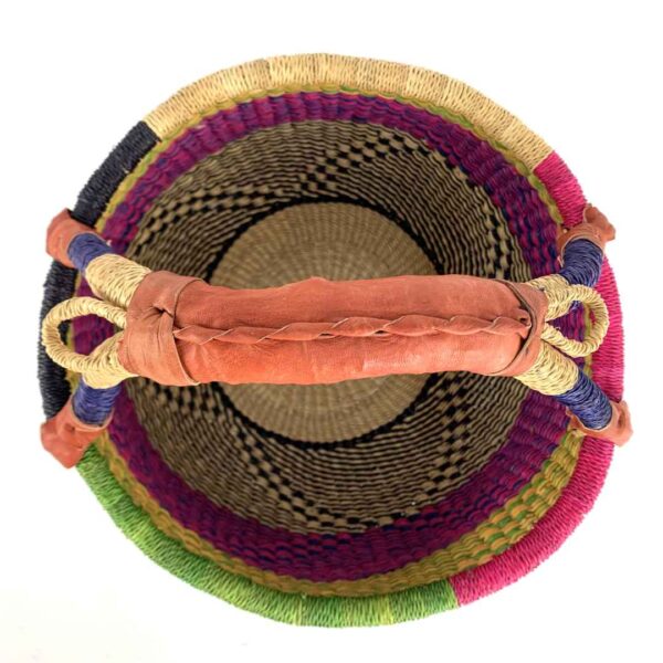 medium-round-basket-675-dove-woven-3 Front view of the medium round Bolga basket with a natural top band flecked green and orange, with a magenta and navy diamond pattern below