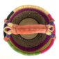 Front view of the medium round Bolga basket with a natural top band flecked green and orange, with a magenta and navy diamond pattern below