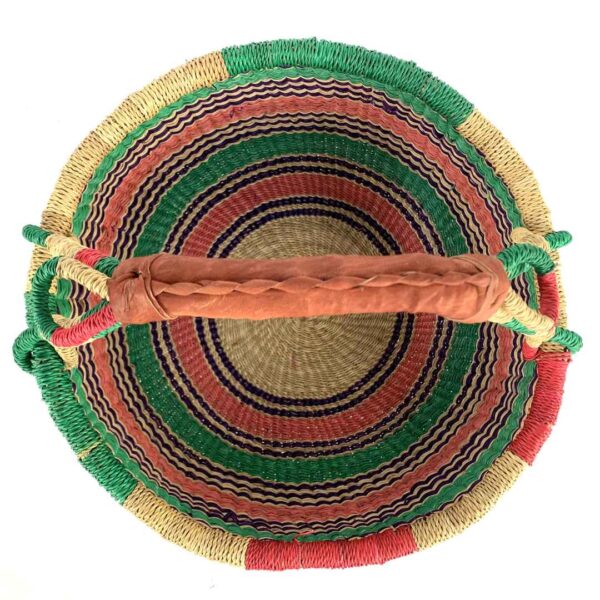 medium-round-basket-680-heron-woven-3 Front view of the medium round Bolga basket with a natural-and-red rim with green, purple and coral horizontal stripes