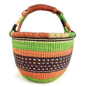 medium-round-basket-682-hoopoes-woven-2 Angled view of the medium round Bolga basket showing an orange-and-cream rim with green, orange and plum bands, the plum band with cream dot detail