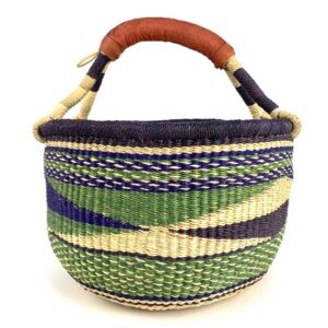 Angled view of the medium round Bolga basket showing a dark purple rim with a green, navy and cream diagonal wave pattern