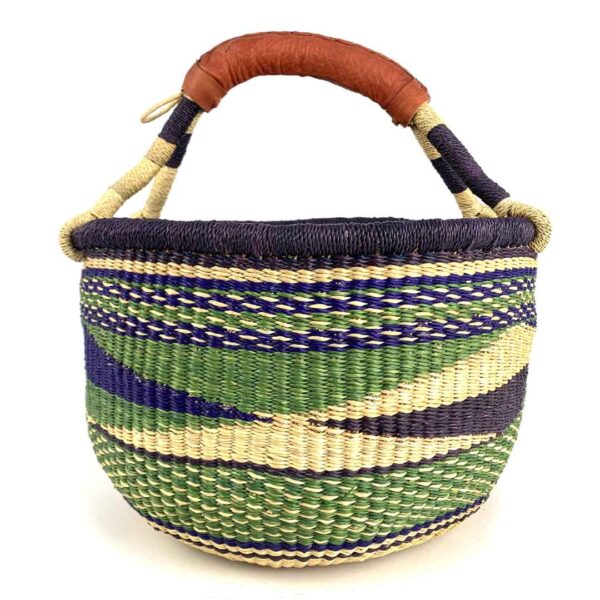 medium-round-basket-683-sunbird-woven-2 Angled view of the medium round Bolga basket showing a dark purple rim with a green, navy and cream diagonal wave pattern