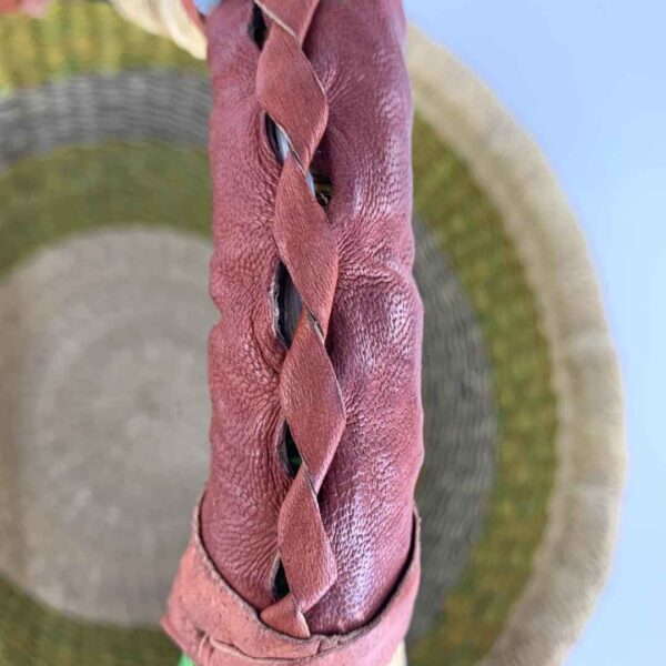 medium-round-basket-686-wilson-fresh-tone-banded-bolga-woven-bashiri-5 Close-up of the uneven stitching along the leather handle