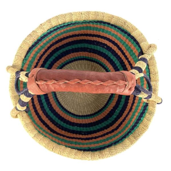 medium-round-basket-691-slipandslide-cool-warm-striped-bolga-african-basket-bashiri-2 Top view of the cool and warm striped medium round Bolga basket showing the woven interior and handle