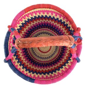 Top view of the bright stepped-stripe medium round Bolga basket showing the woven interior and handle