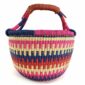 Front view of the bright stepped-stripe medium round Bolga basket, handwoven from elephant grass