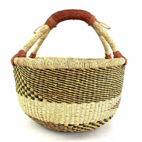medium-round-basket-695-galaxy-neutral-monochrome-bolga-african-basket-bashiri-3 Front view of the neutral-toned medium round Bolga basket with a dark diagonal pattern, handwoven from elephant grass