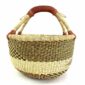 Front view of the neutral-toned medium round Bolga basket with a dark diagonal pattern, handwoven from elephant grass
