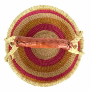 Top view of the warm pastel banded medium round Bolga basket showing the woven interior and handle