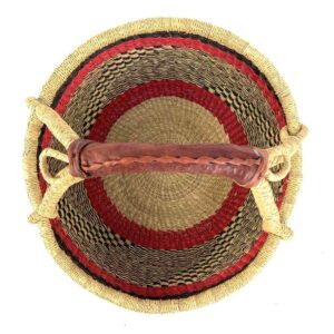 Top view of the warm and dark banded medium round Bolga basket showing the woven interior and handle