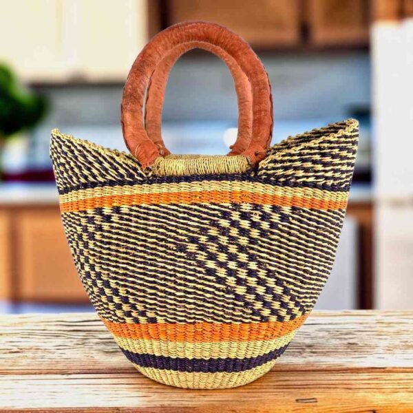 Mini market basket with a dark zigzag pattern on a natural weave and leather-wrapped handles