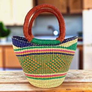 Mini market basket with bright rim bands over a soft, earthy patterned body and leather-wrapped handles