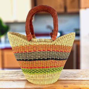 Mini market basket with warm, earthy stripes on a natural weave and leather-wrapped handles