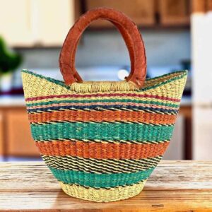 Mini market basket with bold stripes in bright warm and cool tones and leather-wrapped handles