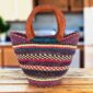 Mini market basket with fine stripes in deep, jewel-like tones and leather-wrapped handles