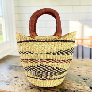 Small handwoven African market basket with carry handle