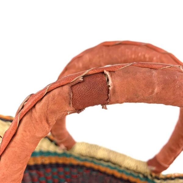 mini-woven-market-basket-334-flush-bashiri-4 Close-up of the imperfection in the leather handle of the mini market basket