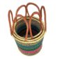 Three teal and pink open laundry baskets nested inside each other