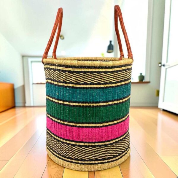 open-laundry-basket-116-spandex-teal-pink-set-bolga-woven-bashiri-main Open laundry basket with teal, green and pink bands with black checked rims and tall leather handles