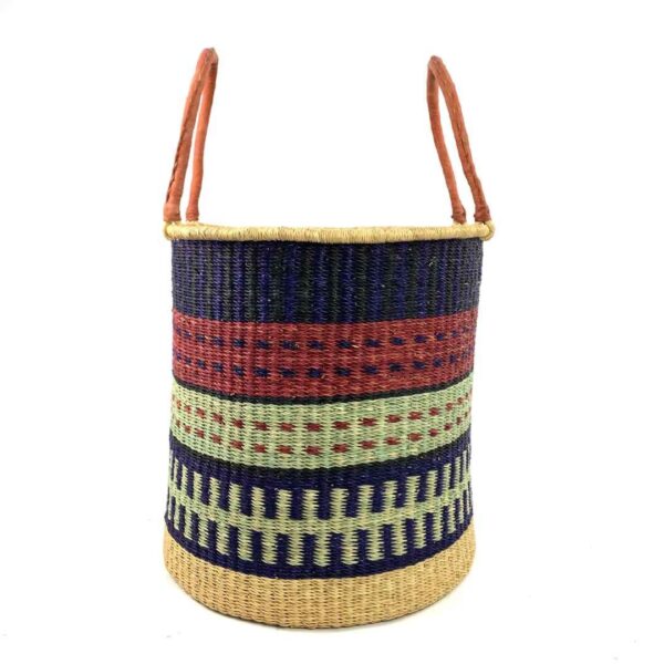open-laundry-basket-117-mythic-navy-red-woven-bashiri-3 Front view of the open laundry basket with navy and red bands with a pale green check and tall leather handles on a white background