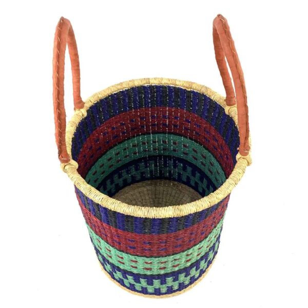 open-laundry-basket-118-epic-navy-green-african-bashiri-2 Angled view of the open laundry basket with navy, red and mint green bands and tall leather handles