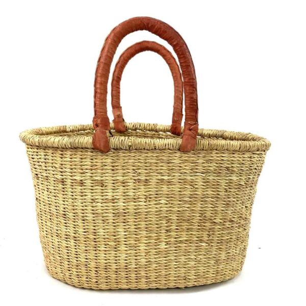 oval-basket-475-bottomless-natural-african-woven-bashiri-3 Front view of the oval Bolga basket with natural undyed straw on a white background