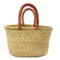 Front view of the oval Bolga basket with natural undyed straw on a white background